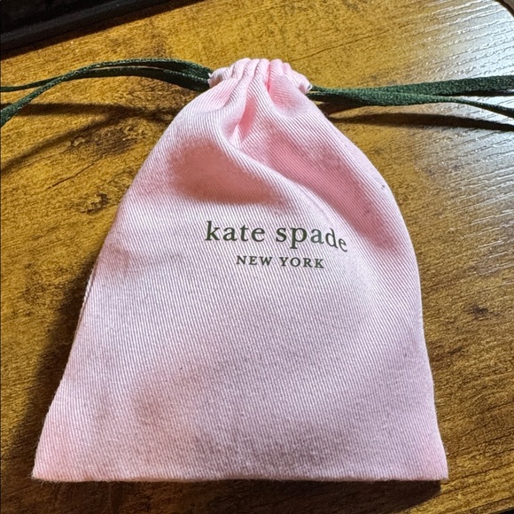Kate Spade Silver Bangle with Pink Pouch
“Find the silver lining” - Picture 6 of 6